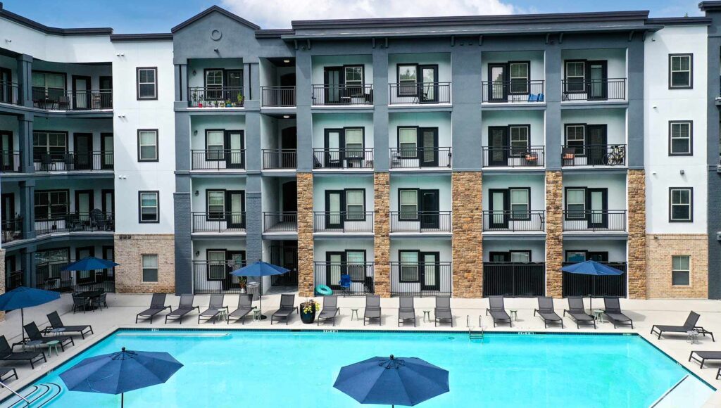 View of the pool and pool deck from an upper level balcony